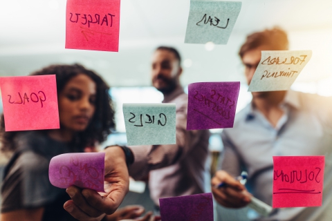 business people brainstorming with sticky notes